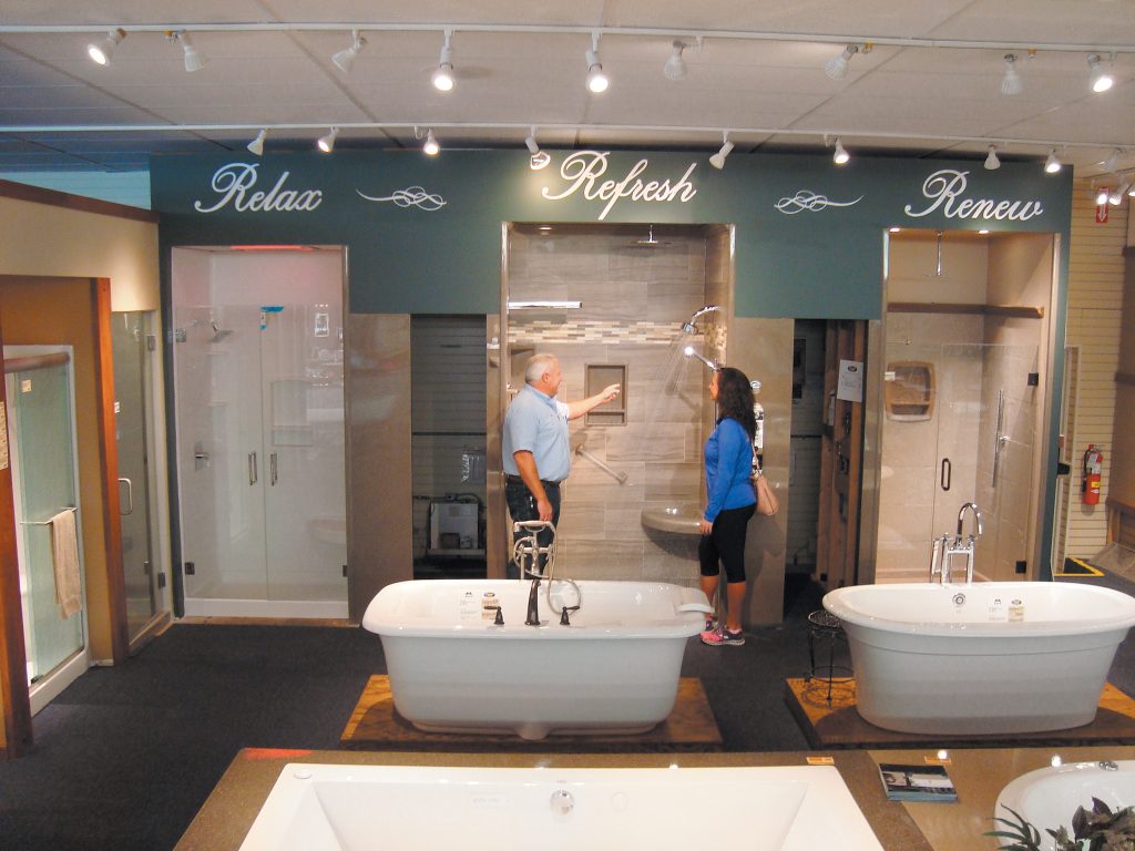 Man and woman looking at shower display