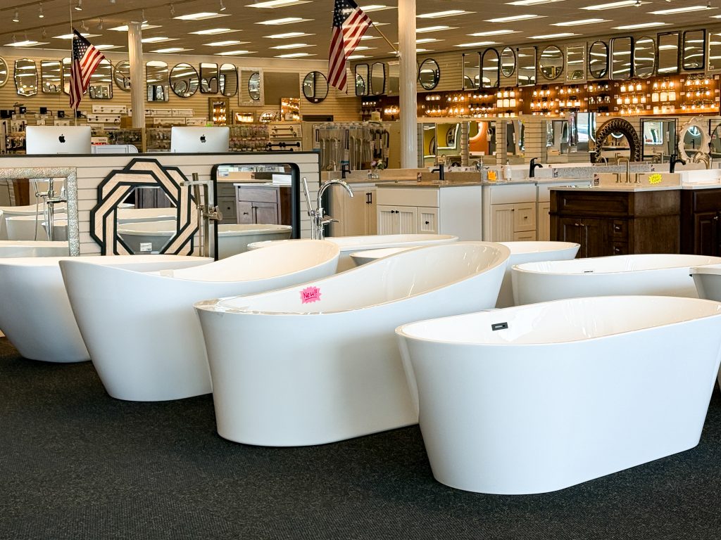 Sioux Falls showroom featuring a variety of soaking bathtubs as well as vanities, lights, and mirrors.
