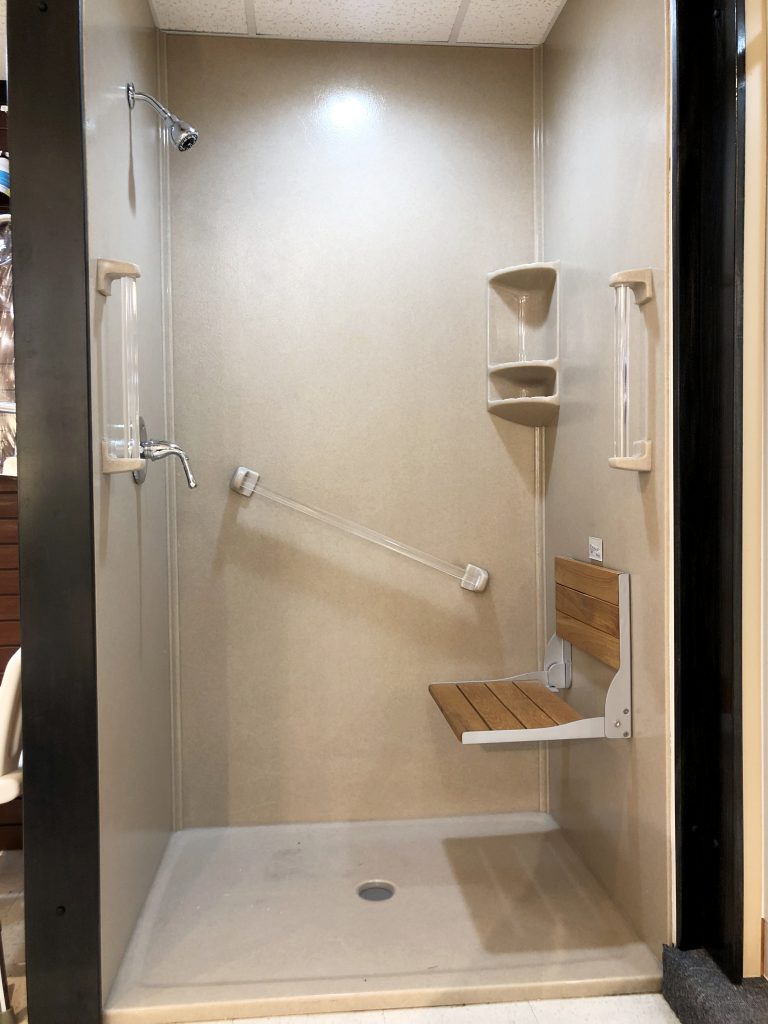 Custom Onyx shower with fold down teak shower seat and accessories